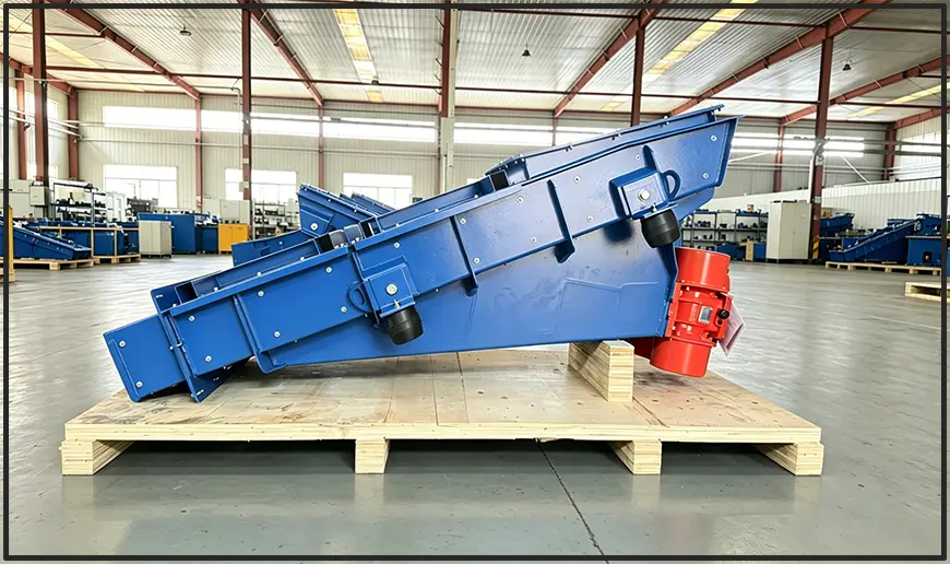 Motor vibrating feeder for glass industry, with red vibration motor and blue painted frame Motor vibrating feeder for glass industry, with red vibration motor and blue painted frame